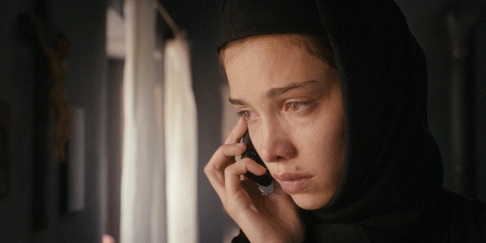Movie poster, a sad woman on the phone
