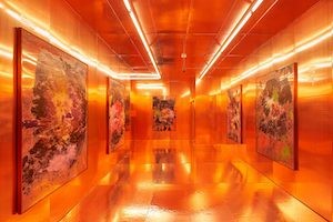 'Colony Sound,' by Jonah Freeman and Justin Lowe a bright orange space with lights and art
