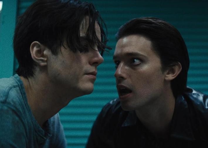 Still from 'Daniel isn't Real,' image courtesy of SXSW Film Festival White dudes in a heated convo in a teal room