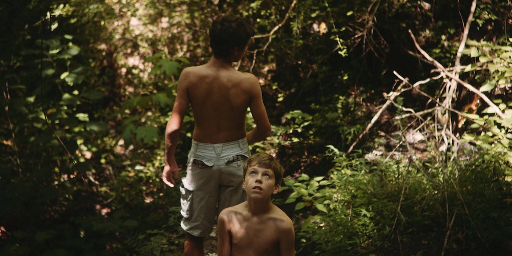Two young boys in a jungle
