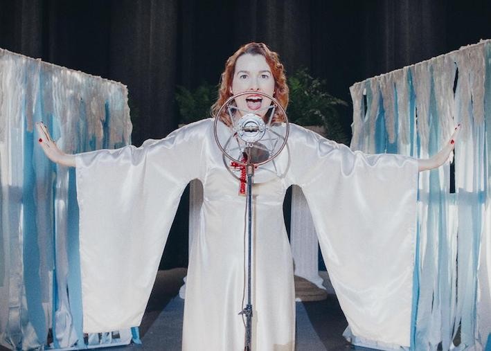 Still from 'Sister Aimee,' image courtesy of SXSW Film Festival Woman singing