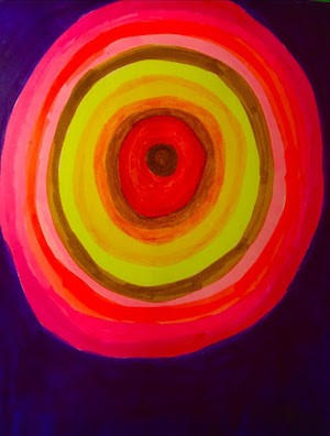 a painting with concentric yellow and pink circles on a dark purple background