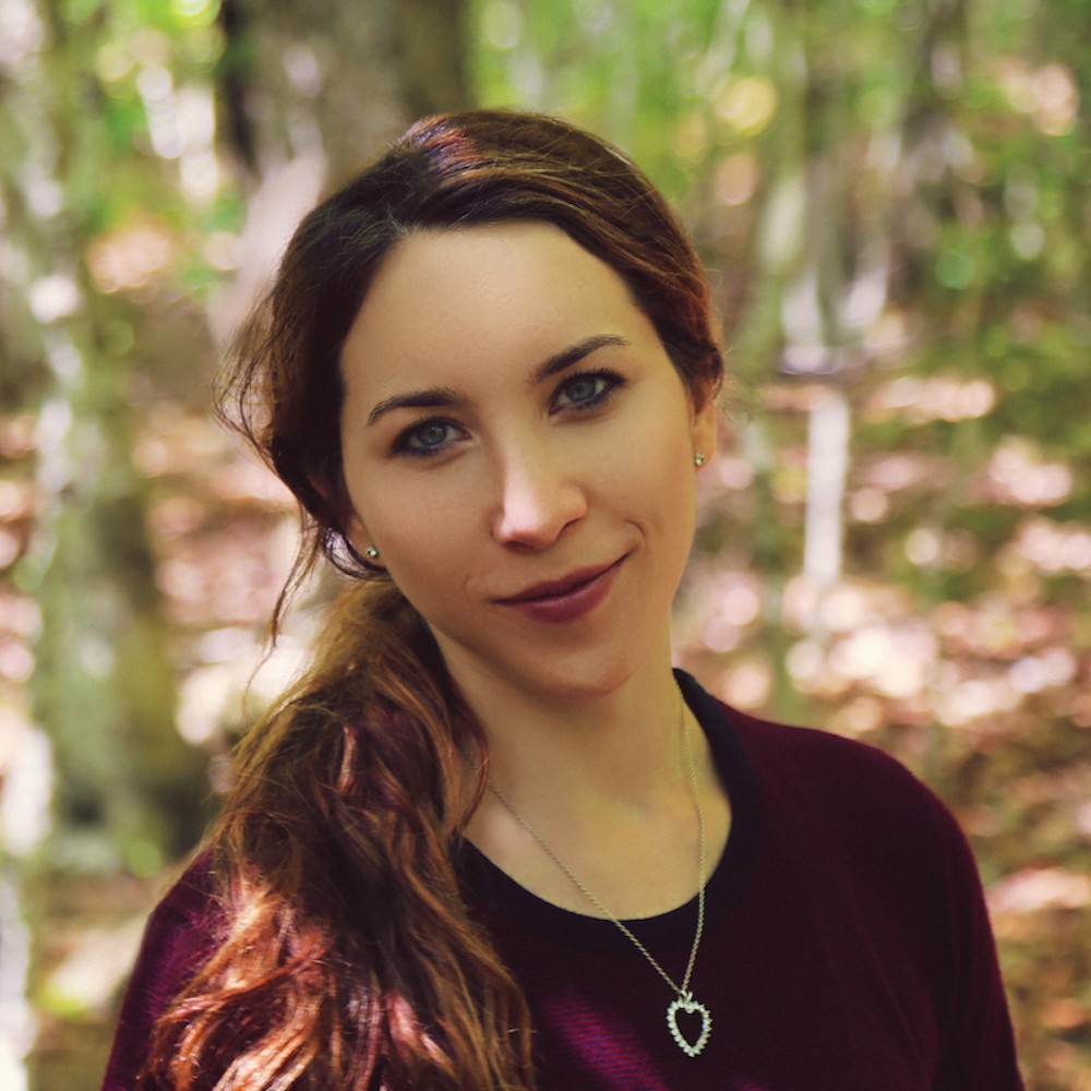 portrait of a girl with brown hair in the woods